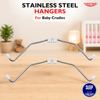Stainless steel hangers for baby cradles with a blurred nursery background