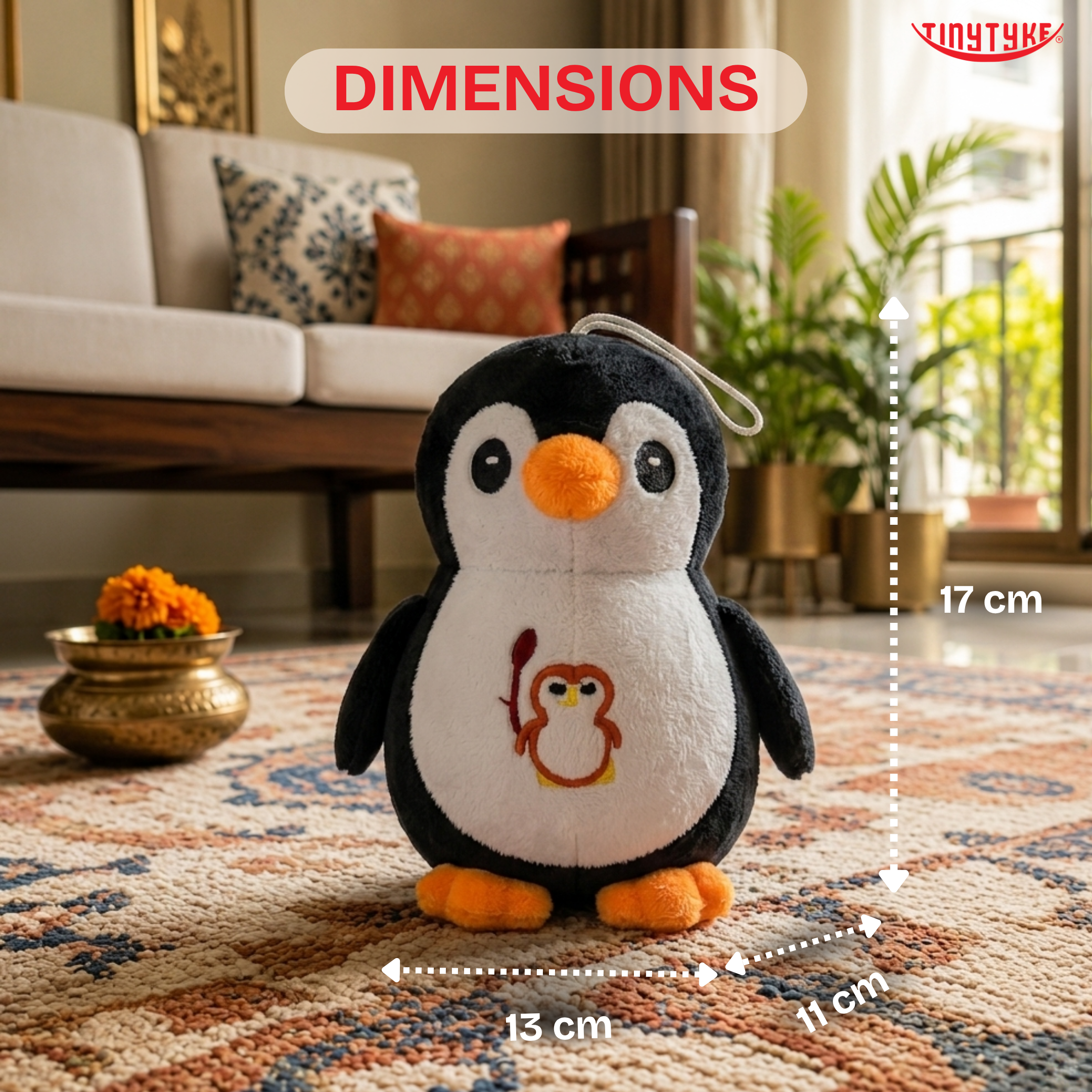 TinyTyke — Plush Baby Penguin Soft Toy with dimensions on a living room rug
