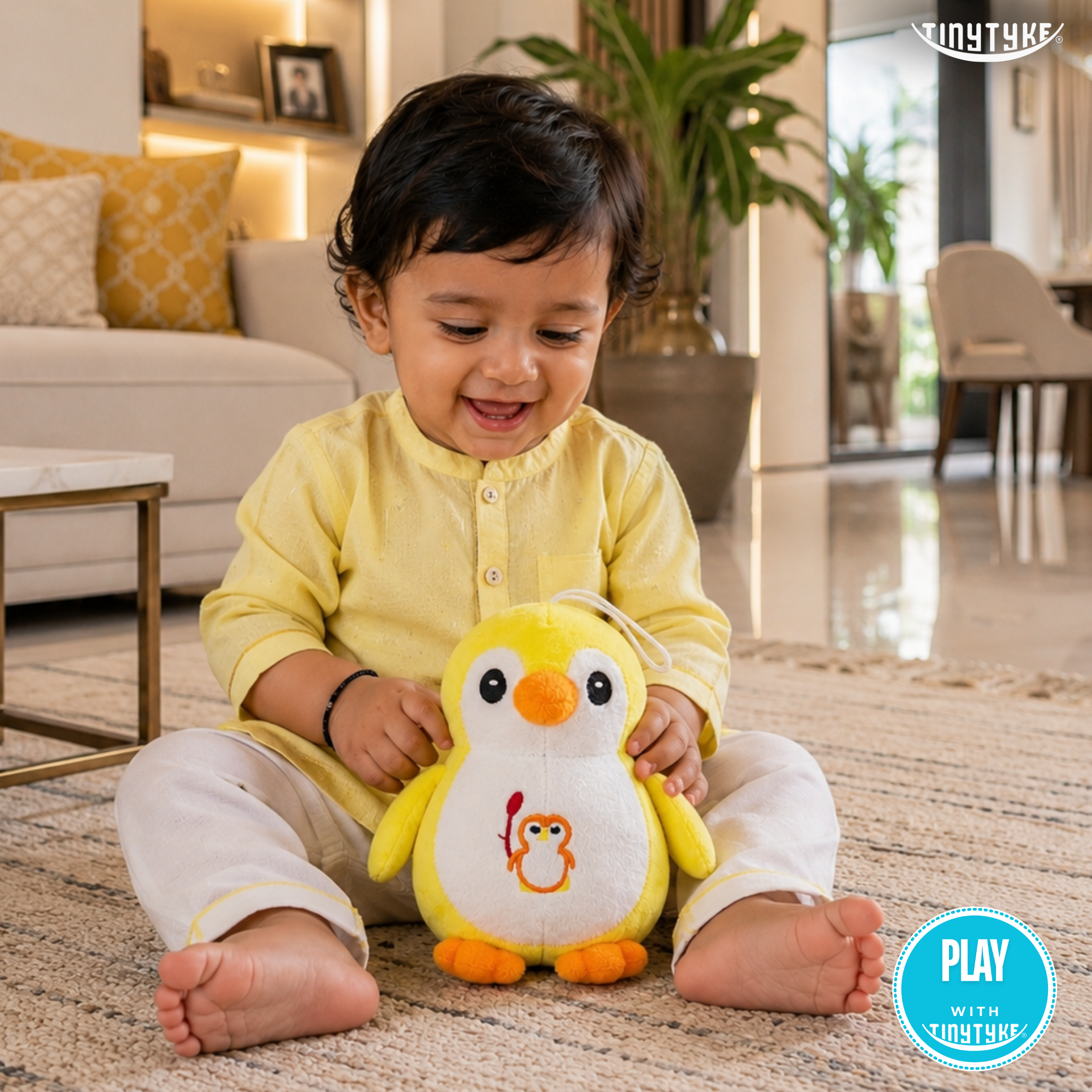 Child playing with a TinyTyke — Plush Baby Penguin Soft Toy in a living room setting