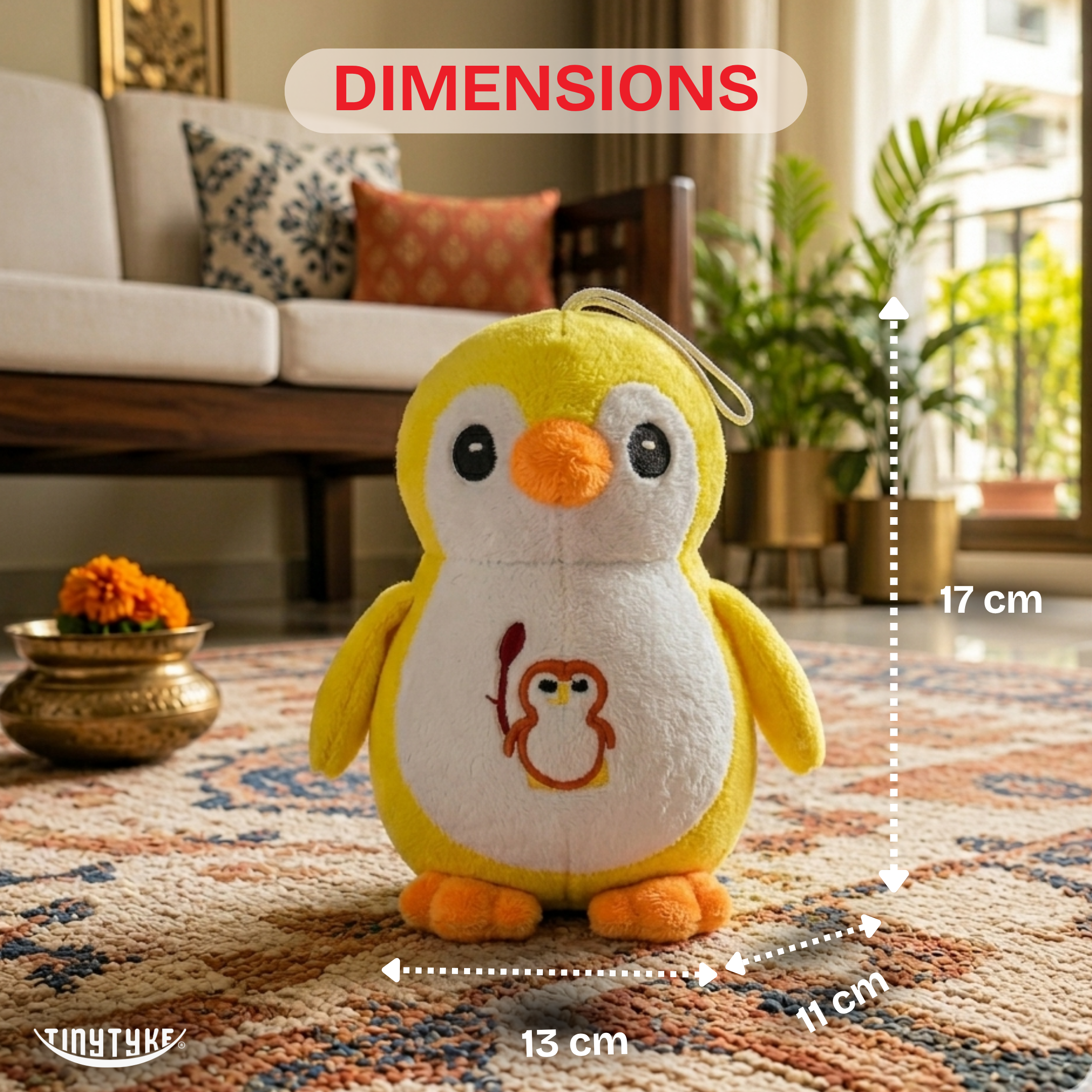 TinyTyke — Plush Baby Penguin Soft Toy with dimensions on a living room rug