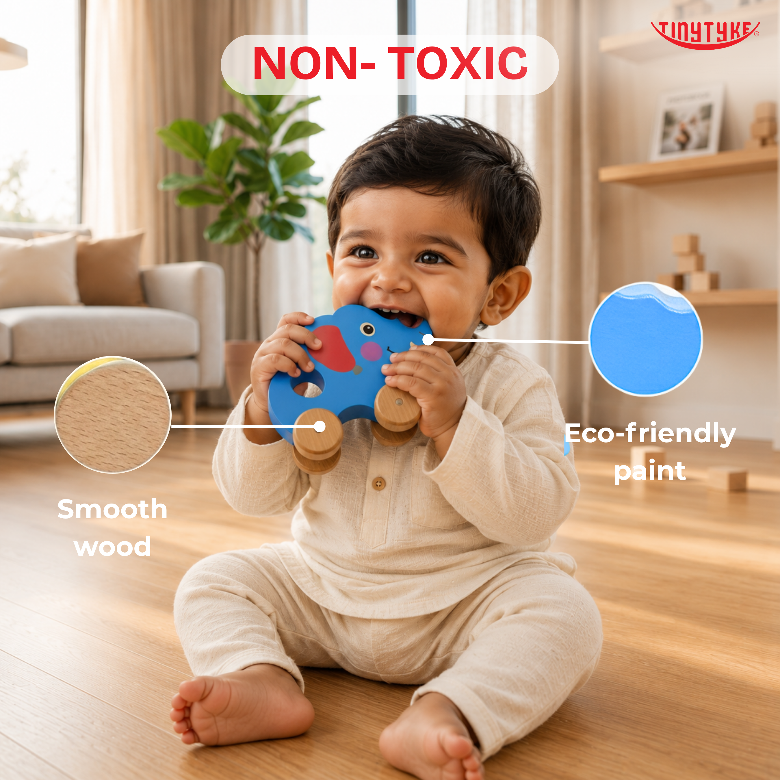 Child playing with a blue Wooden Pull-along Elephant Toy in a living room, highlighting eco-friendly materials.