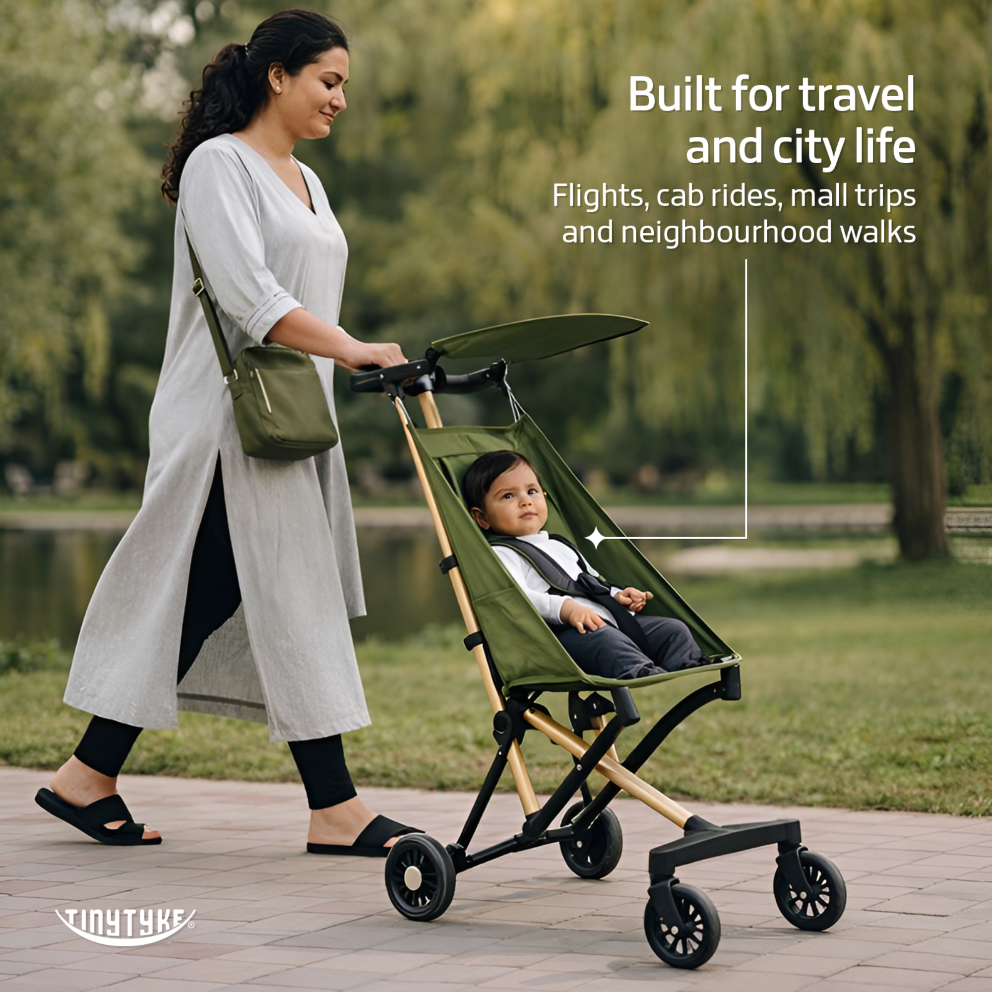 TinyTyke T3 stroller lifestyle — olive green, Indian parent on everyday outdoor walk with toddler in city