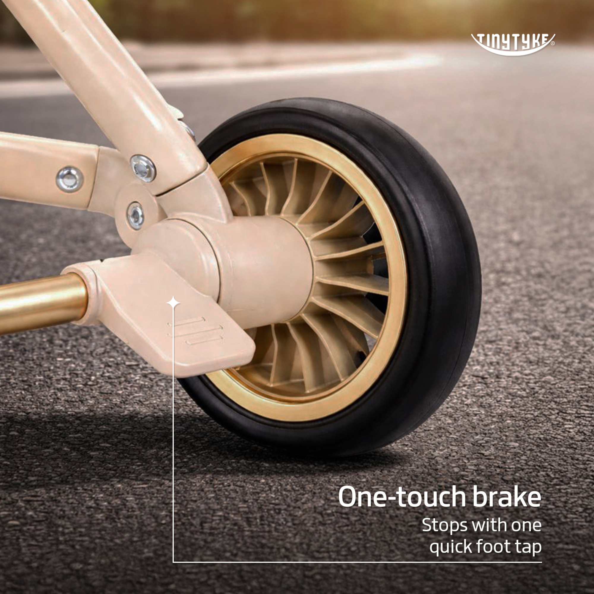 TinyTyke T3 stroller one-touch brake — beige, double foot brake stops on slopes, keeps stroller stable hands-free