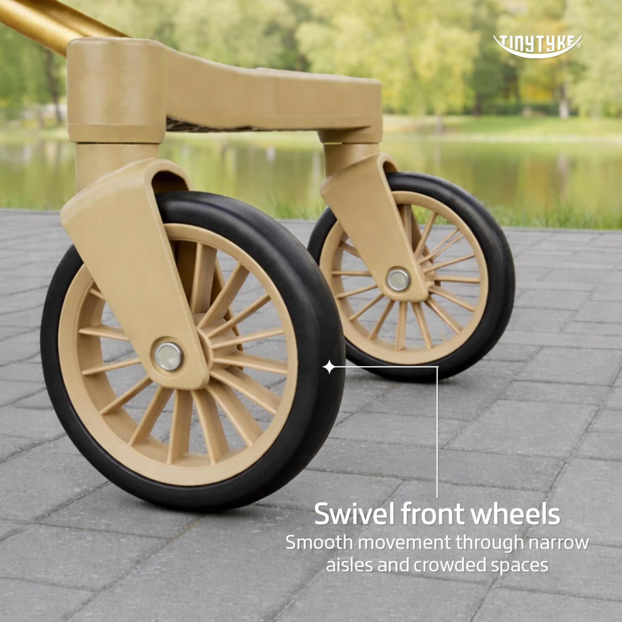 TinyTyke T3 stroller swivel front wheel close-up — beige, 5-inch wheel for smooth turns in tight indoor spaces
